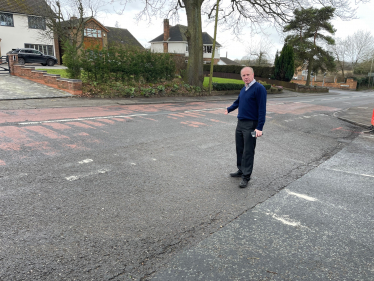 Marco inspecting the damage at the junction between Gospel End Road and the Northway